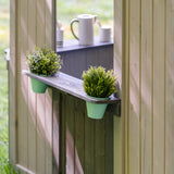jack and june outdoor playhouse with plant pot holders