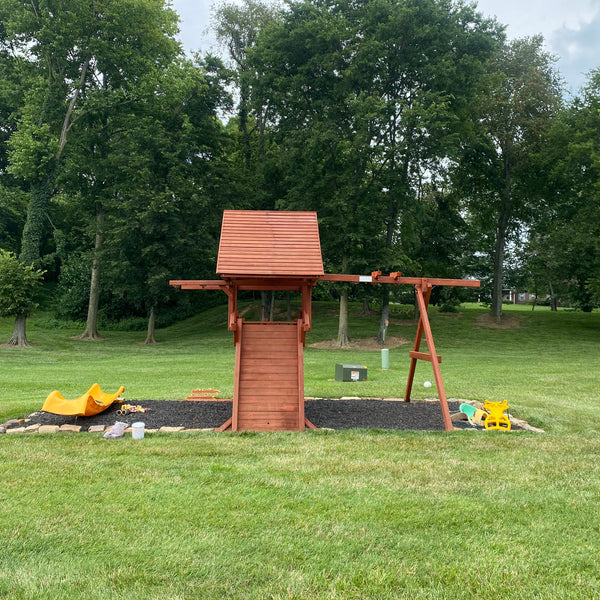 a swingset being built in a backyard