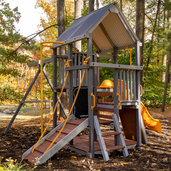 woodplay playset with swings and rock climbing wall 