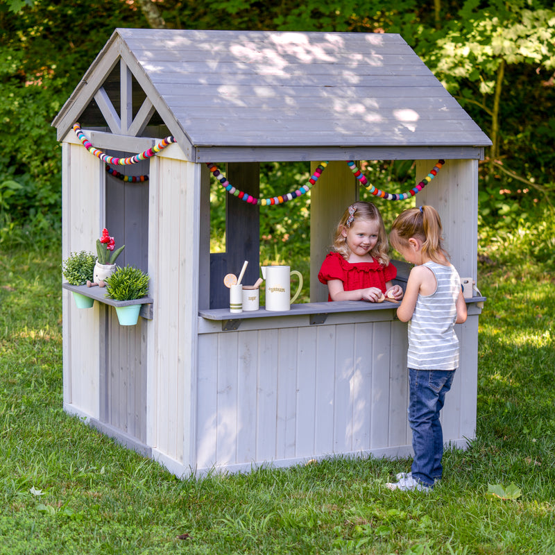 children playing with outdoor play structure - childs playhouse