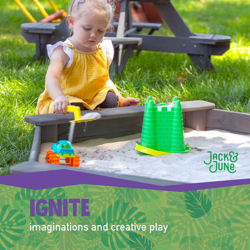 little girl playing in jack and june hexagonal sandbox - ignite imaginations and creative play